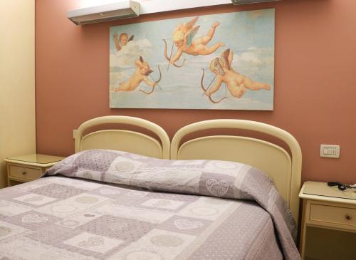 albergo-fratte-camera-matrimoniale-dettaglio-letto